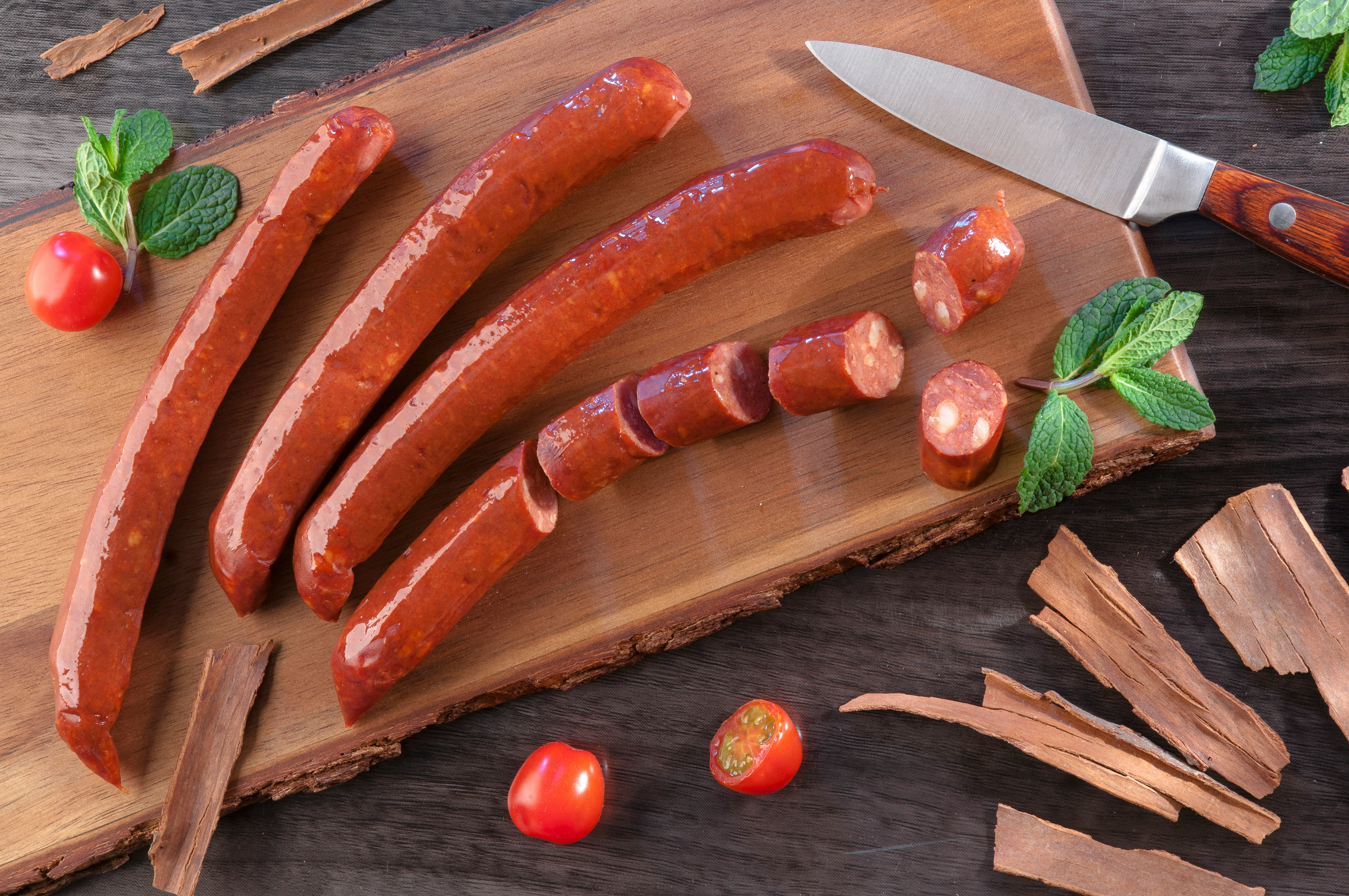 carrots and green chili on brown wooden chopping board